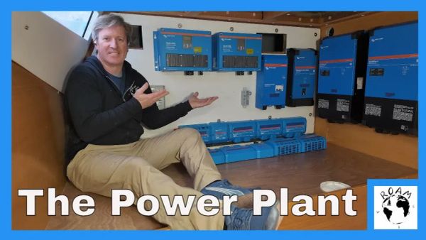 Electrical system components being laid out and installed inside a cruising catamaran during a major refit.