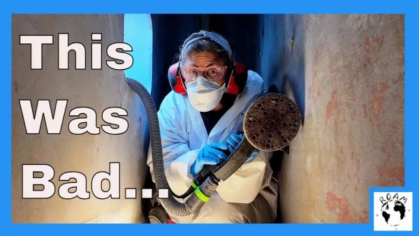 Geri sanding the chain locker and preparing for paint on her cruising catamaran.