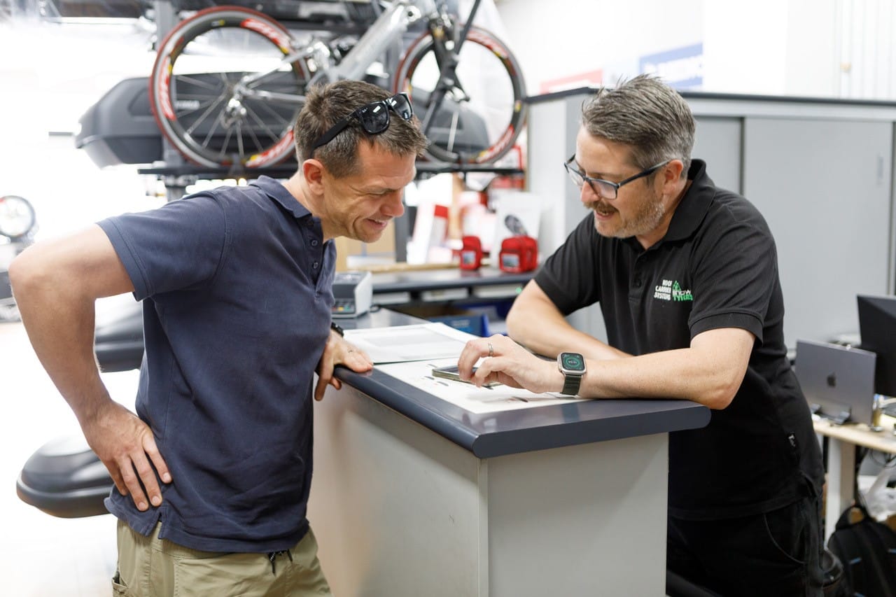 GOOD ADVICE: The staff at Roof Rack Carriers are their to give friendly advice on your needs - Paul Miles (owner) talks with customer is Tim Walker.

