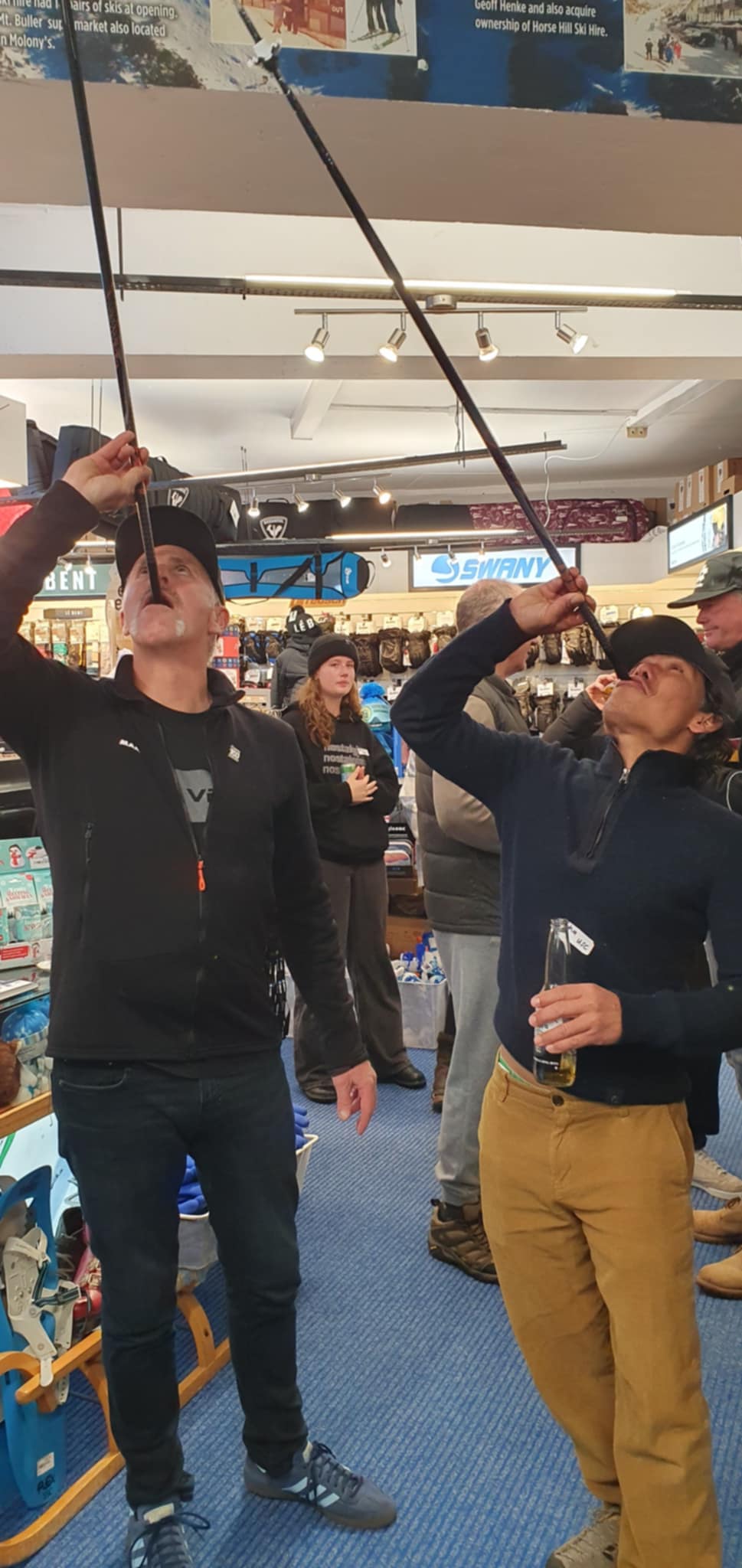 SCULL: Drinking from liquor-filled ski poles were Josh Laney (Chumpy's Lodge) and  j,,a (Tatry).