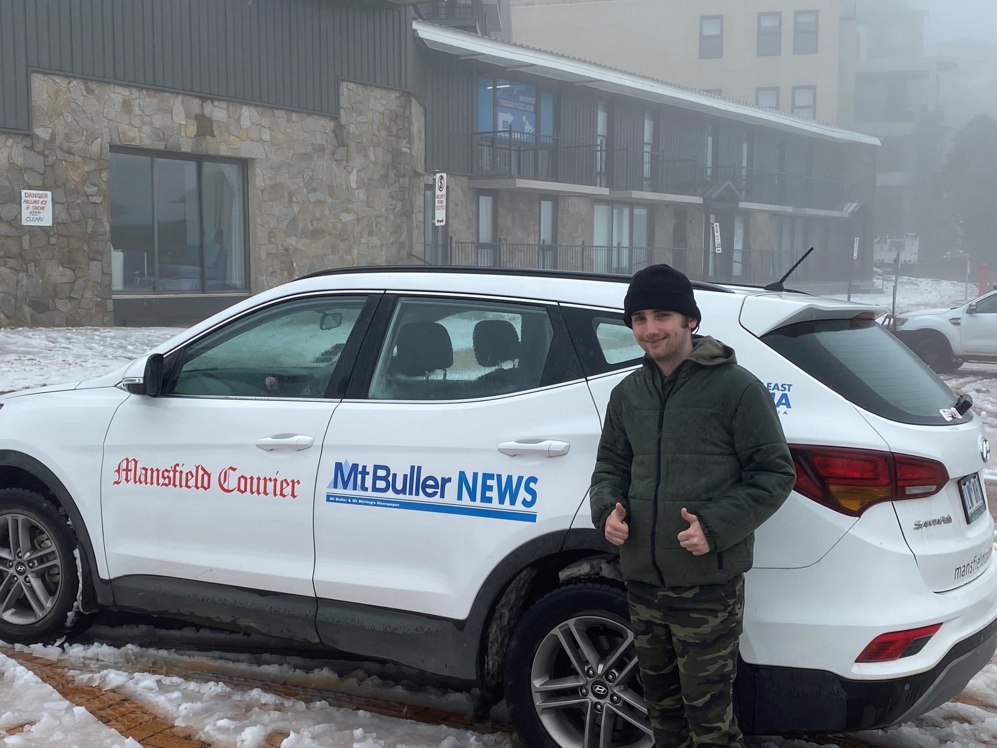 NEW SKILLS: Phillip Manoglou completed his week of work experience at the Mansfield Courier and got to travel up to Buller in the Buller news car completing a snowy interview. PHOTO: Leah Scott 