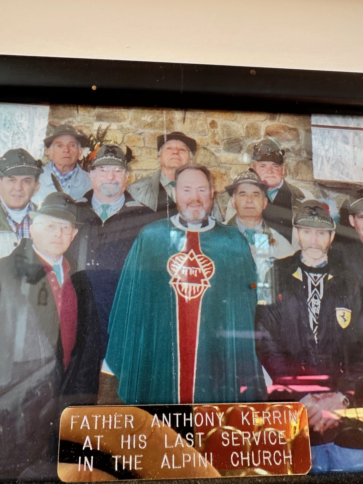 GLORIUOUS MUSIC: Members of the Alpini Choir who sang at the bell tower dedication service in the Alpine Chapel with Fr Tony Kerin centre.