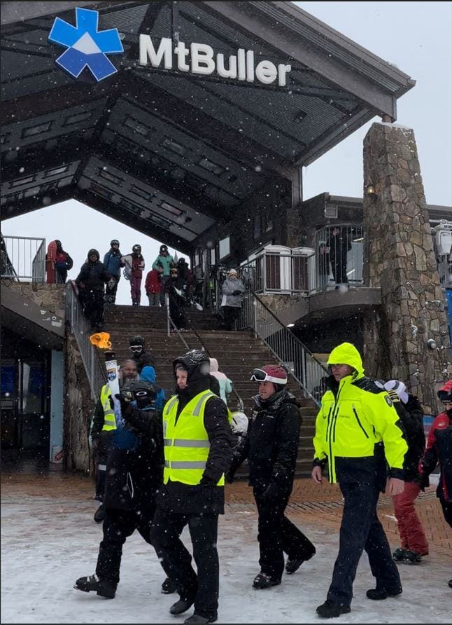 LIT UP: The Torch of Hope makes its way around the Village Square.