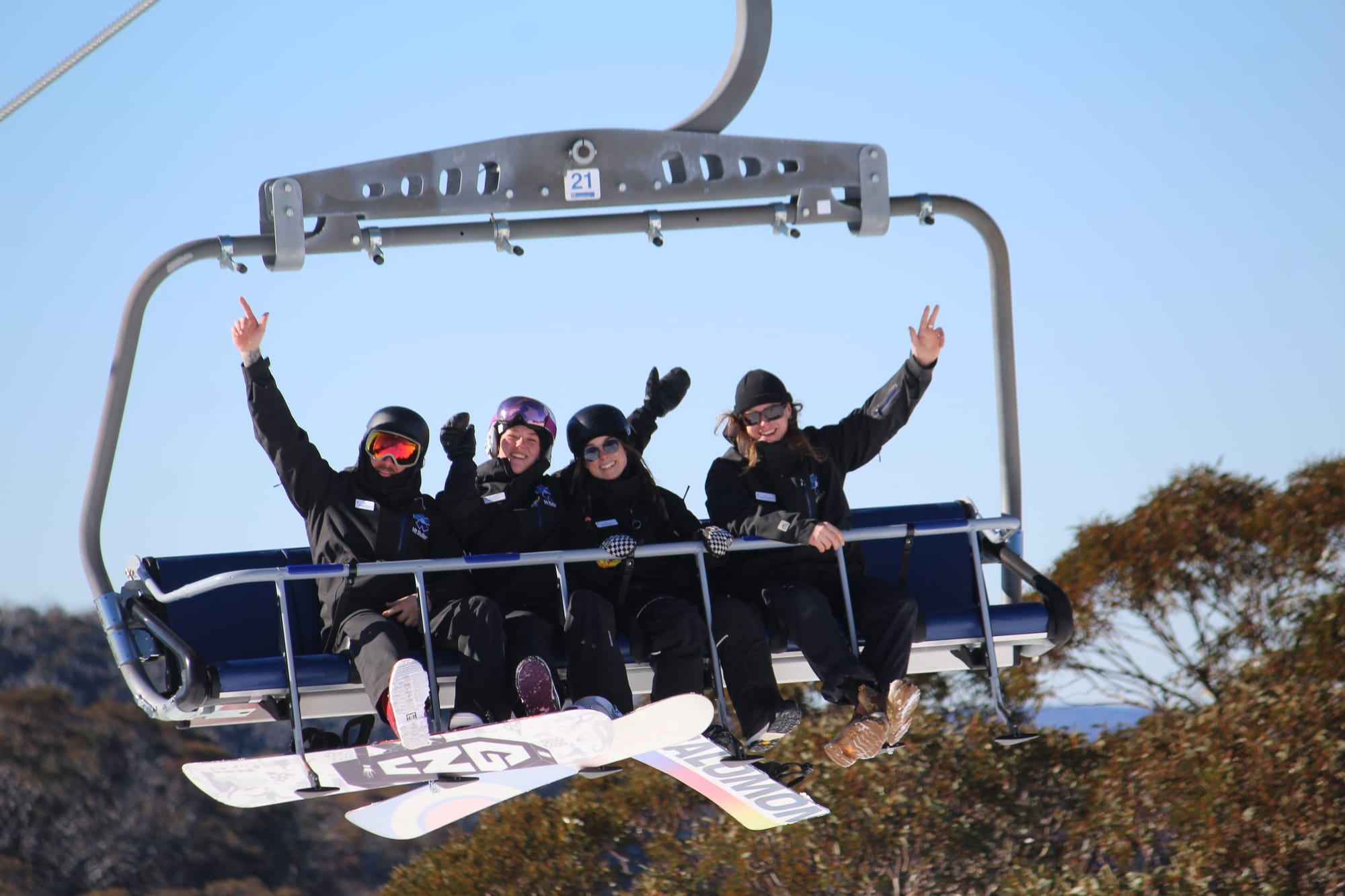SUMMIT CREW: The lift operations team raising their hands to the 75th year of ski lifts on Mount Buller. PHOTO: Trinity Knight