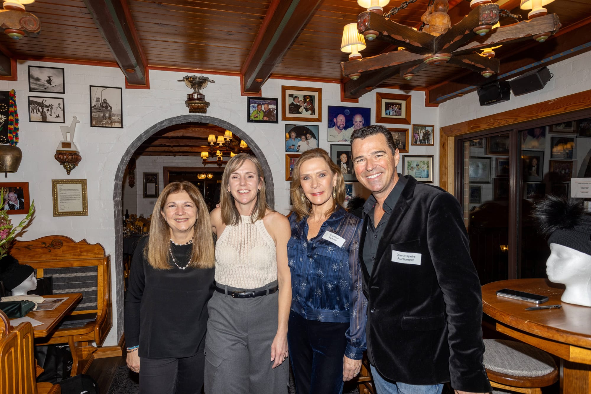 GOOD CAUSE: Paula McCall from Disabled Wintersport Australia (left), Rachael Wadsworth from Multiclass Sports Association, Snow Sisters cofounder Suzanne Rumble with auctioneer David Spiers. PHOTO: Supplied