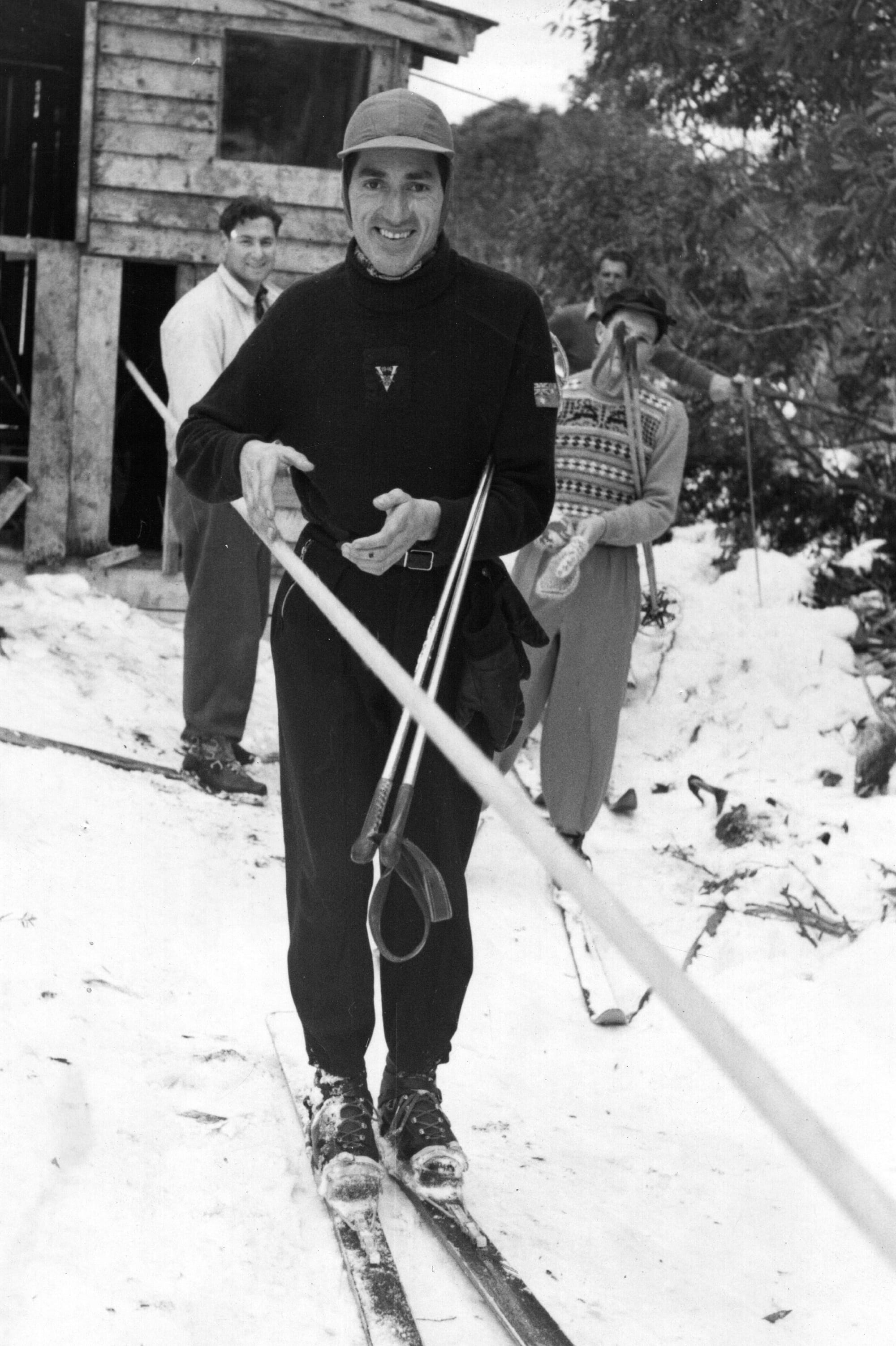 ROPE TOW: Tony Aslangul owner of Auski and future Winter Olympian riding Mt Buller's first Rope Tow on Bourke Street on 3 July 1949. PHOTO: Harold Gibbs, McColl Collection, NAMA