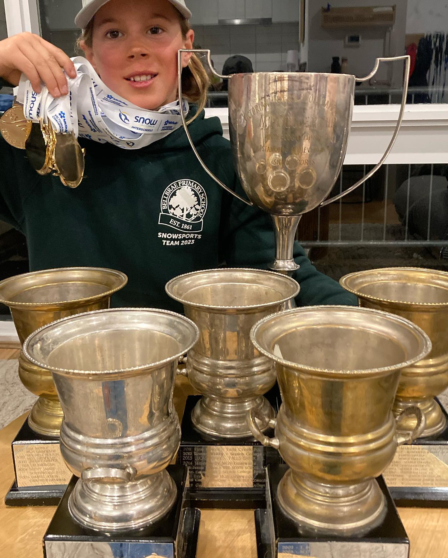 OUR CHAMP: Harlem Pec outstanding skier and snowboarder with his swag of medals and championship cups.