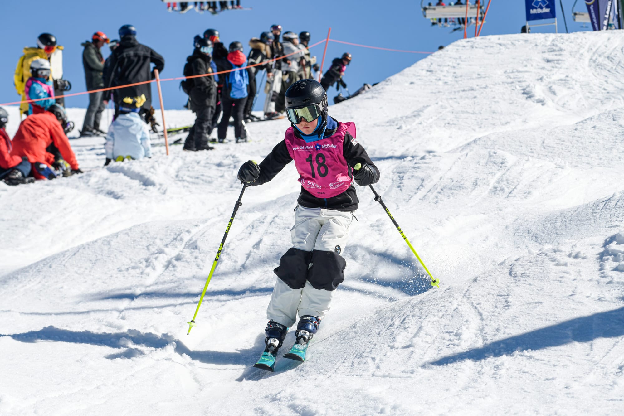 CAREFUL: Guiding through the gates of the moguls this competitor is all concentration.