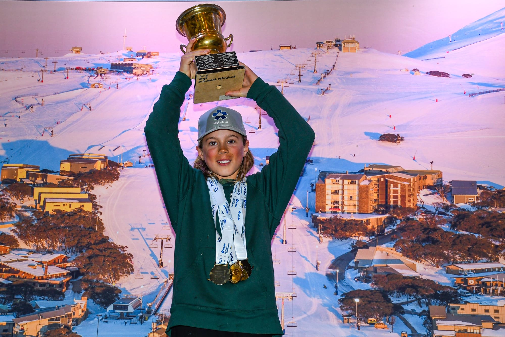 CHAMPION: Harlem Pec proudly displays the Buller Cup which was presented to him as overall champion winning his events in Division 5 boys, both skiing and snowboarding.

