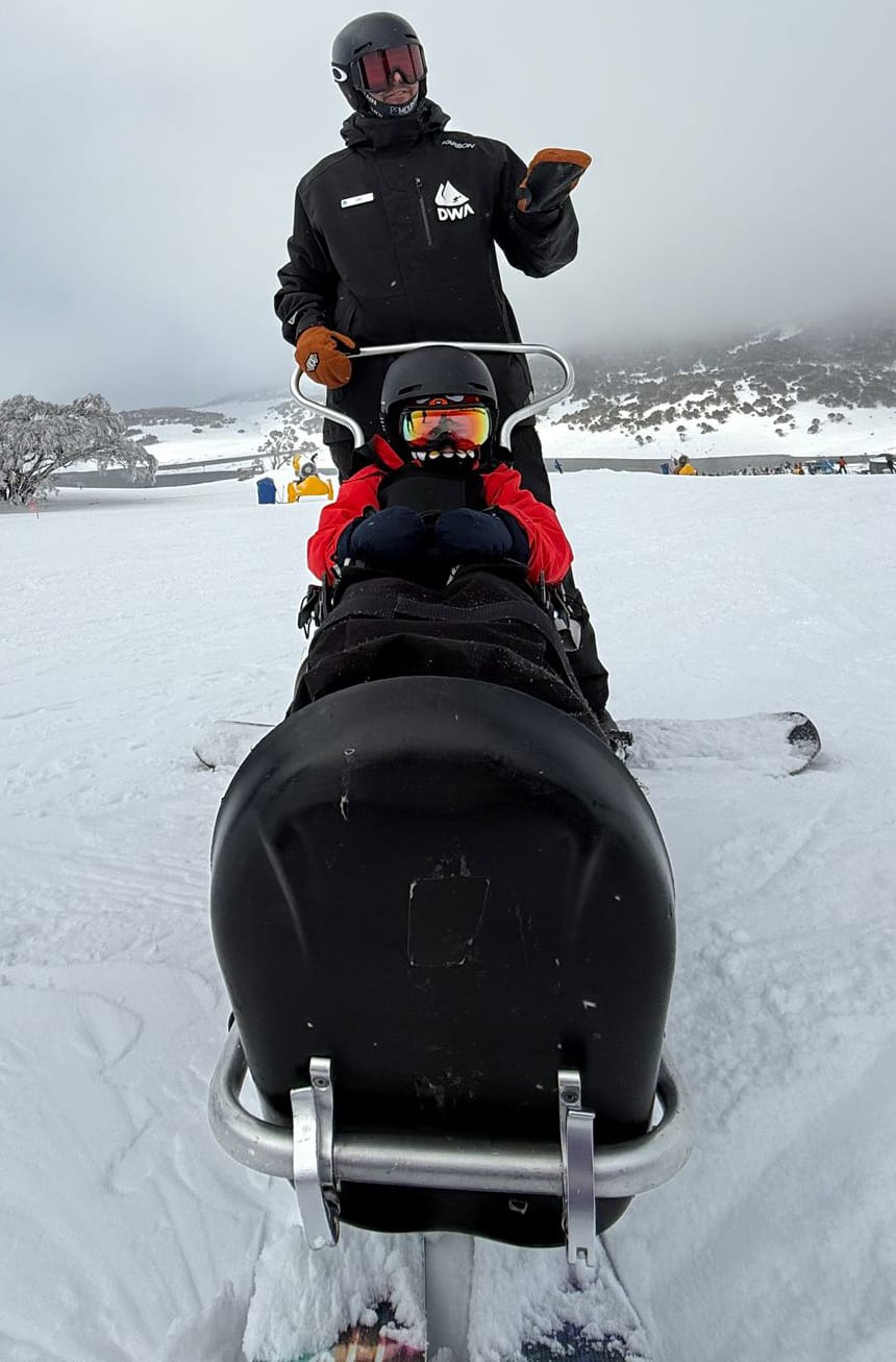 ON THE JOB: DWA guide Zac Howard with a member in a sitski. PHOTO: Paul Lamb 