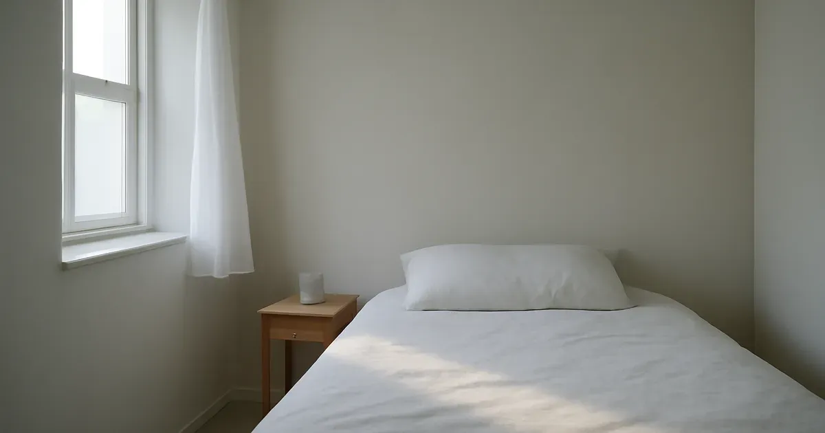 Cool minimalist bedroom environment supporting sleep architecture and cortisol balance during menopause