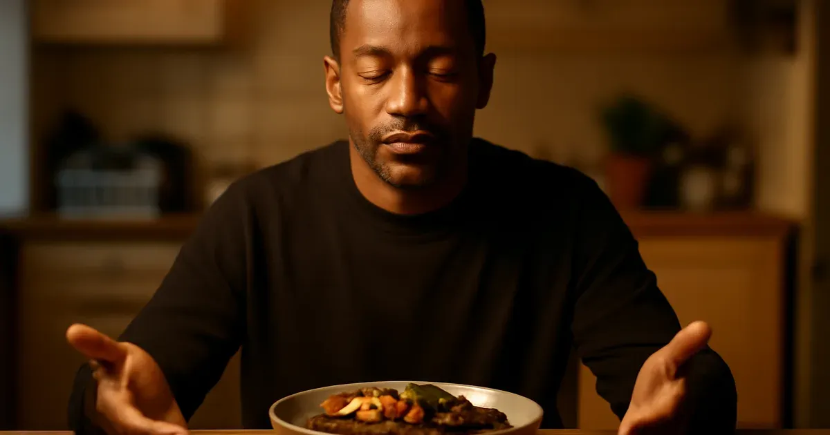 Man practising humming breath technique before an evening meal to stimulate the vagus nerve and support gut health