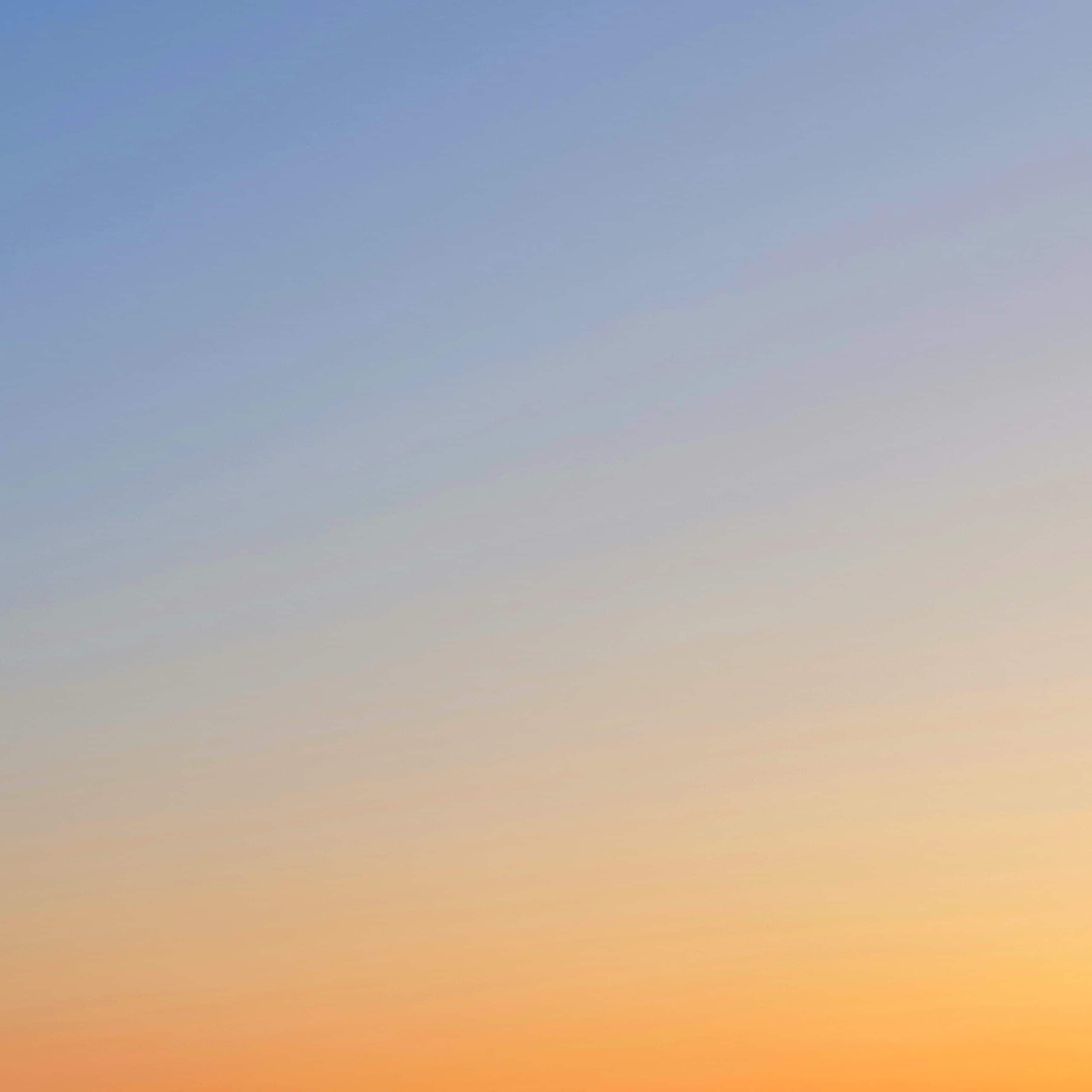 Himmel vid solnedgång, en gradient från orange till blått.
