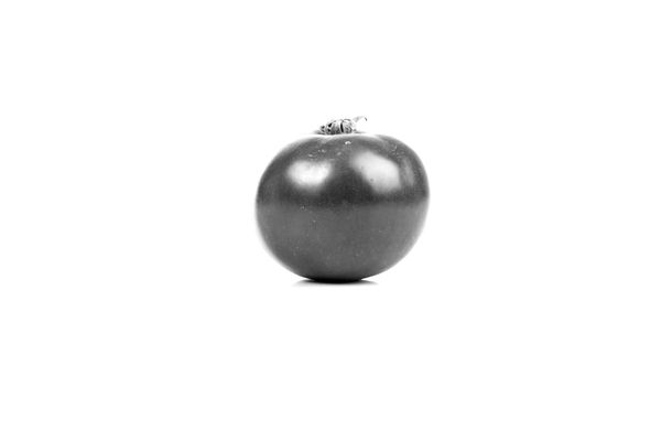 Immagine di un timer a forma di pomodoro su una scrivania, simbolo della tecnica per la produttività.