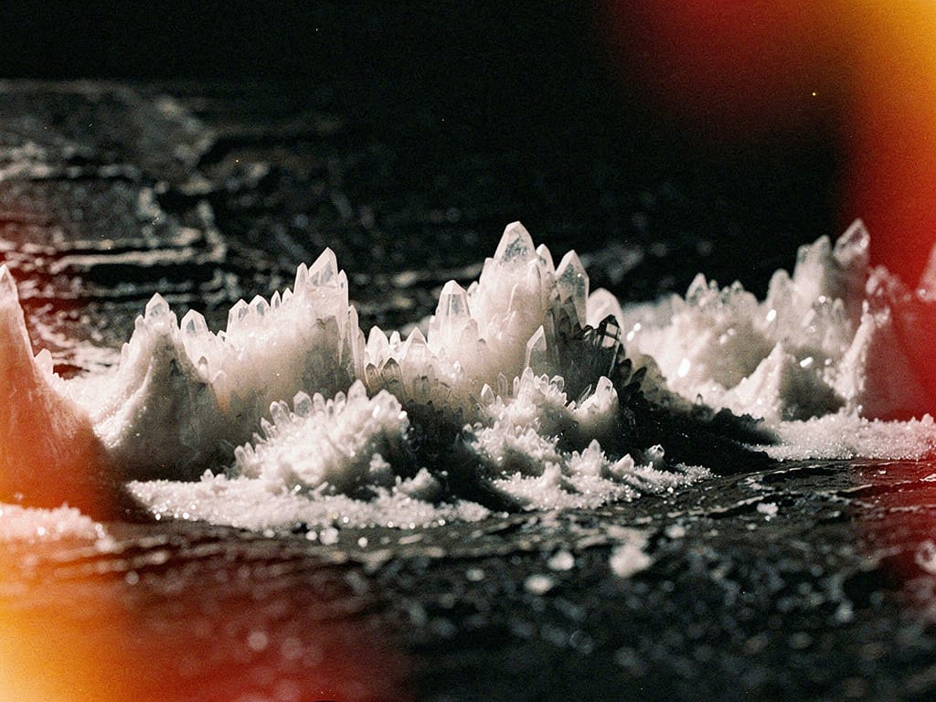 Microscopic view of mineral crystals forming on a surface