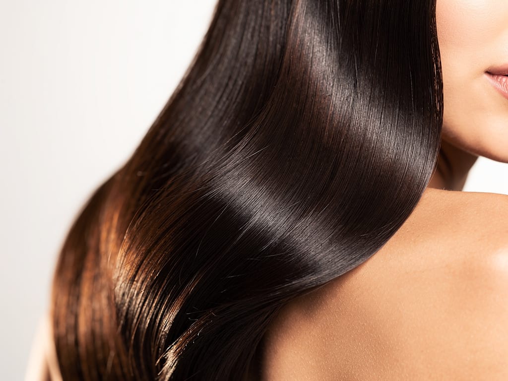 Woman with healthy glossy hair close-up