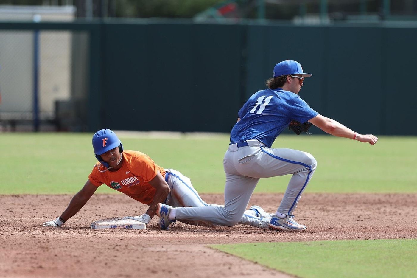 Florida shortstop Brendan Lawson reaches to tag Nic Partridge sliding into second base during fall practice