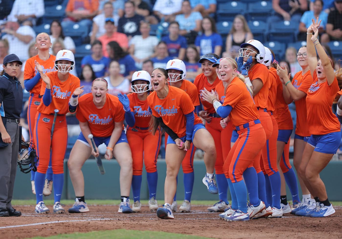 Florida softball players celebrate at home plate