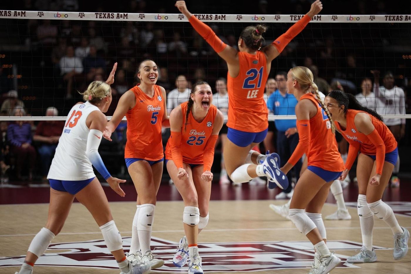 Florida volleyball players celebrate a point at Texas A&M