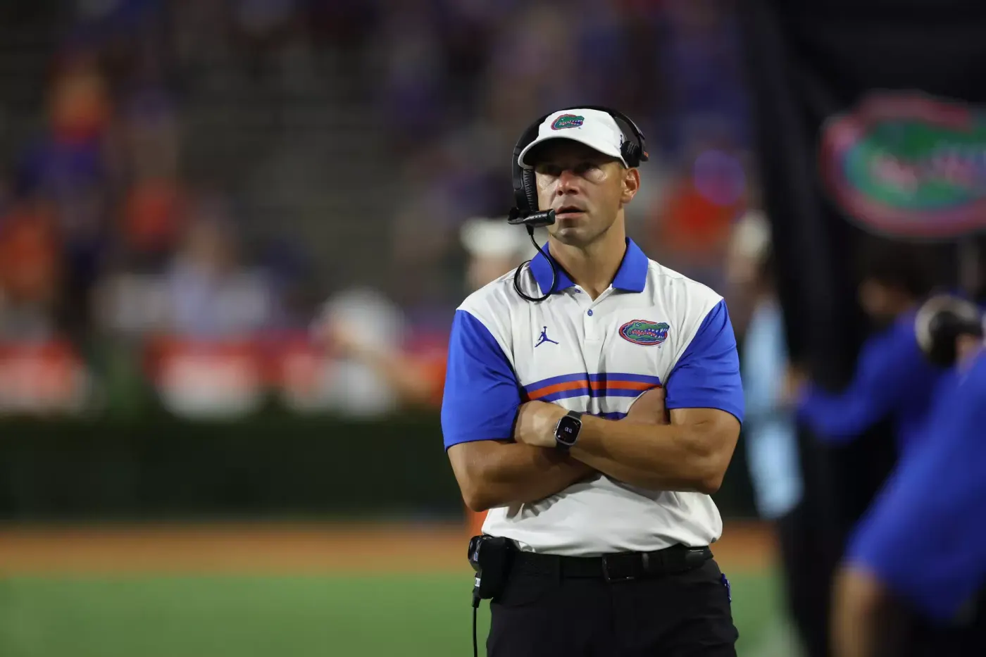 Florida coach Jon Sumrall stands with arms crossed on the sideline at Ben Hill Griffin Stadium