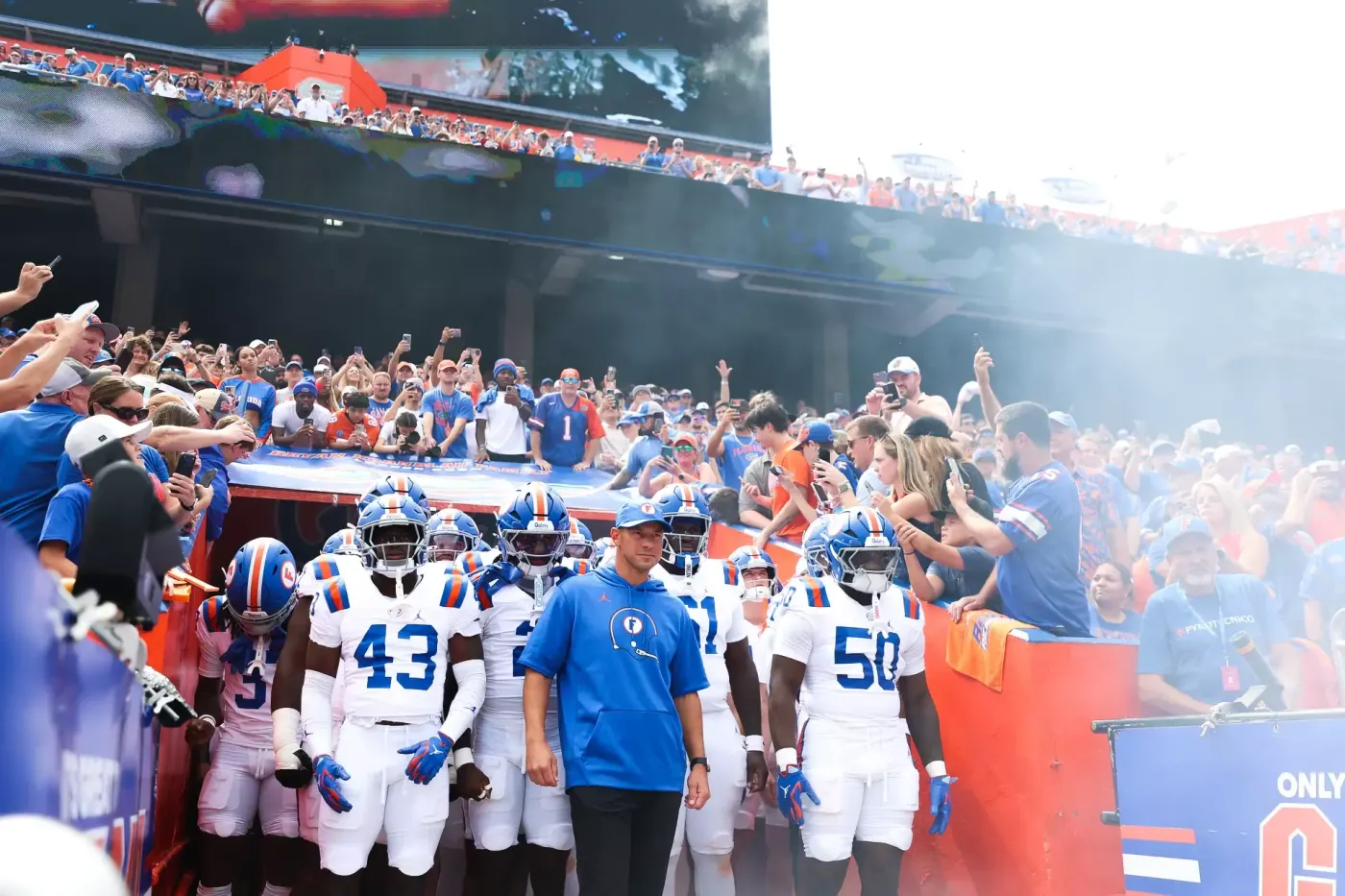 Florida head coach Jon Sumrall leads the Gators out of the tunnel at Ben Hill Griffin Stadium