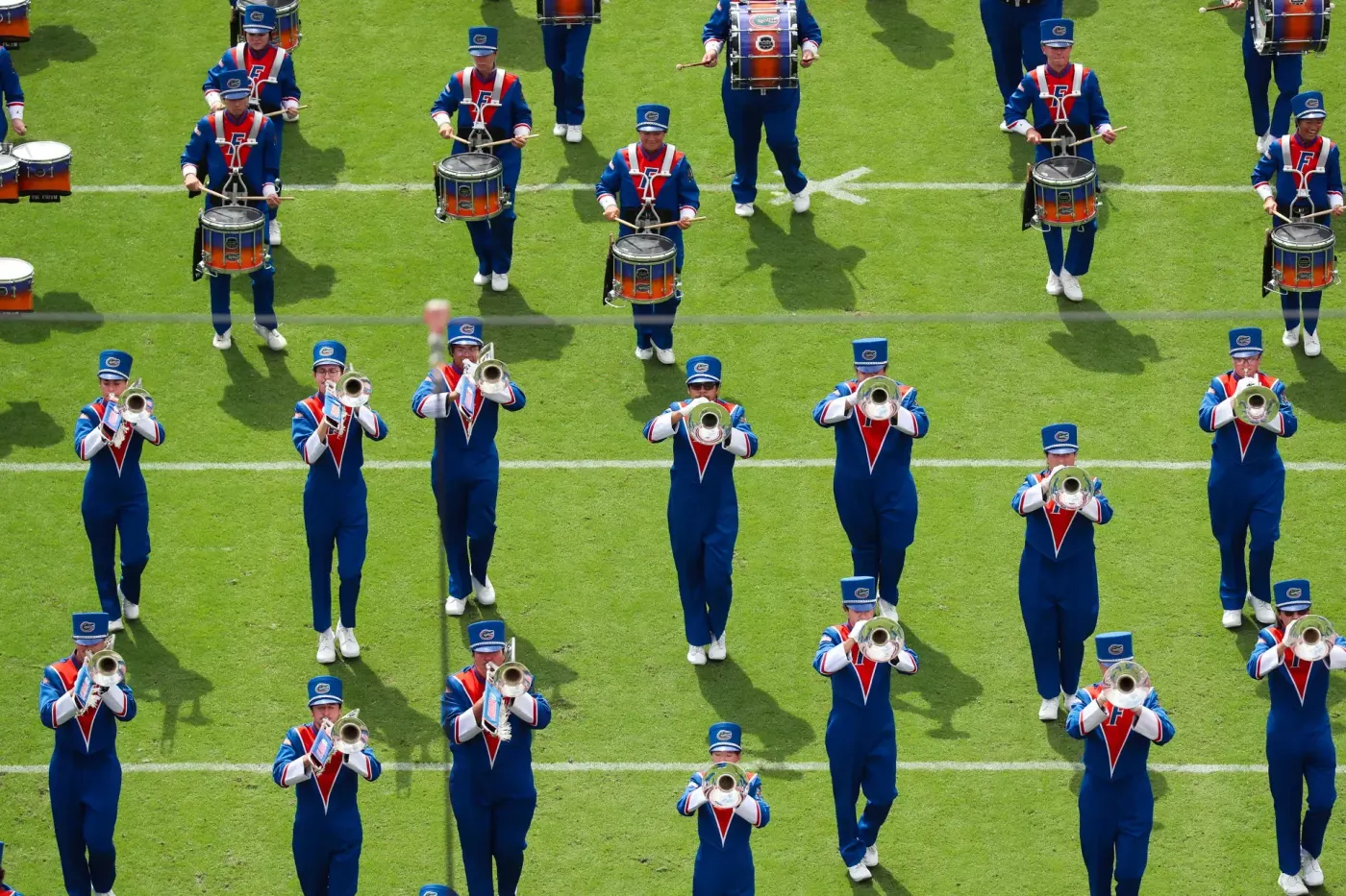 The Pride of the Sunshine marching band performs at Ben Hill Griffin Stadium