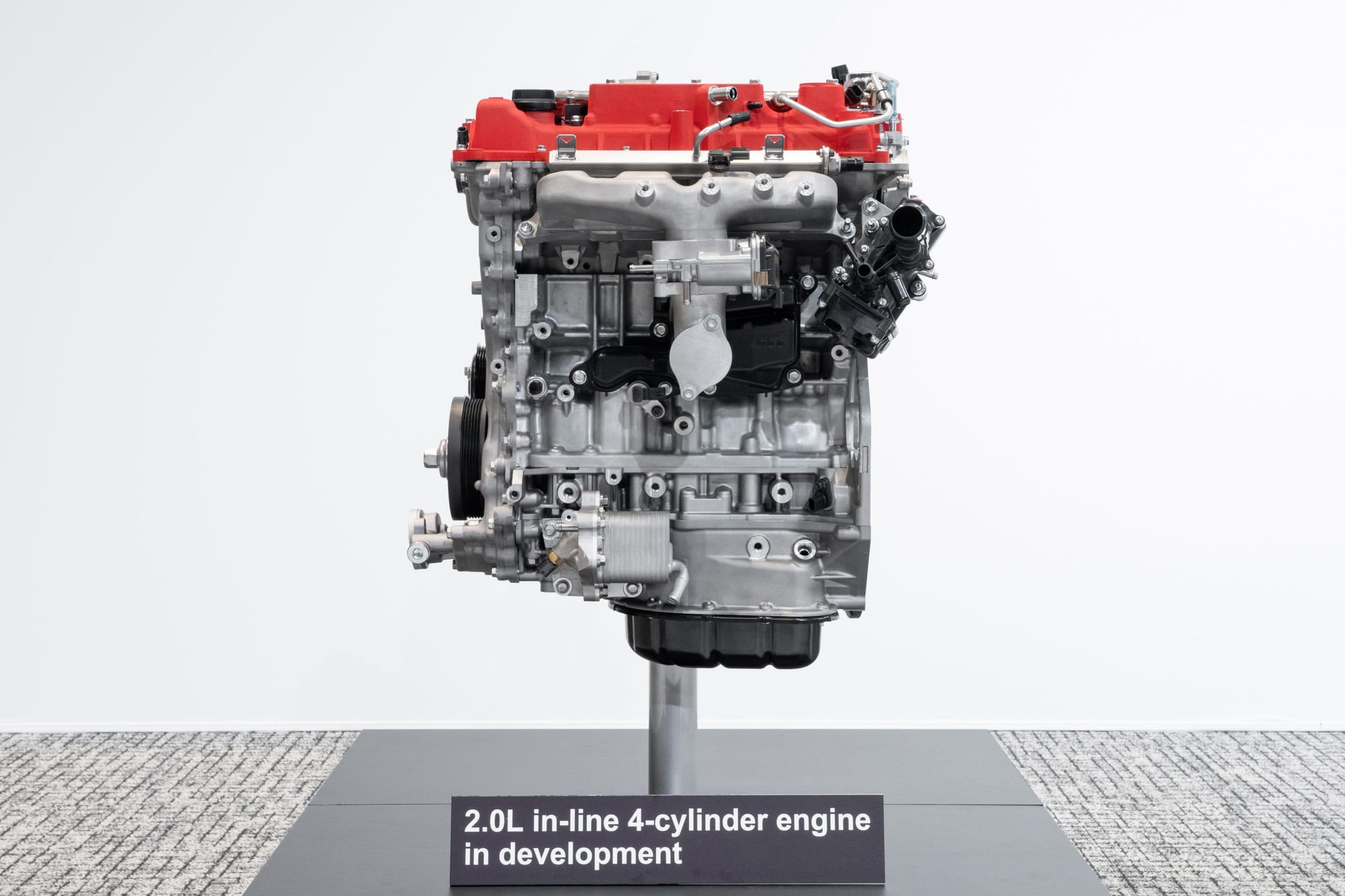 Toyota's new 2.0-litre engine in 2024 on a stand