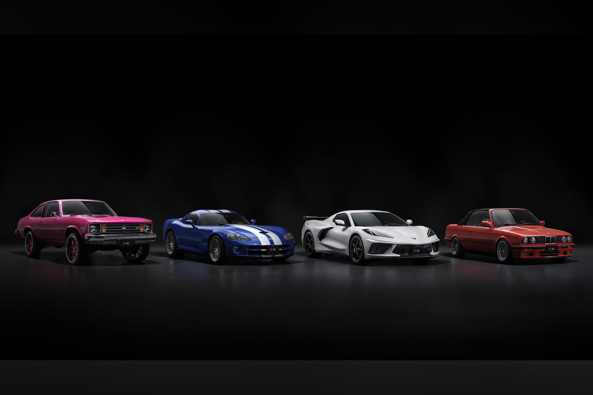 A 1975 Chevrolet Nova (left), 2006 Dodge Viper (centre-left), a 2022 Chevrolet Corvette C8 Stingray (centre-right), and 1992 E30 BMW 325i Convertible (right)