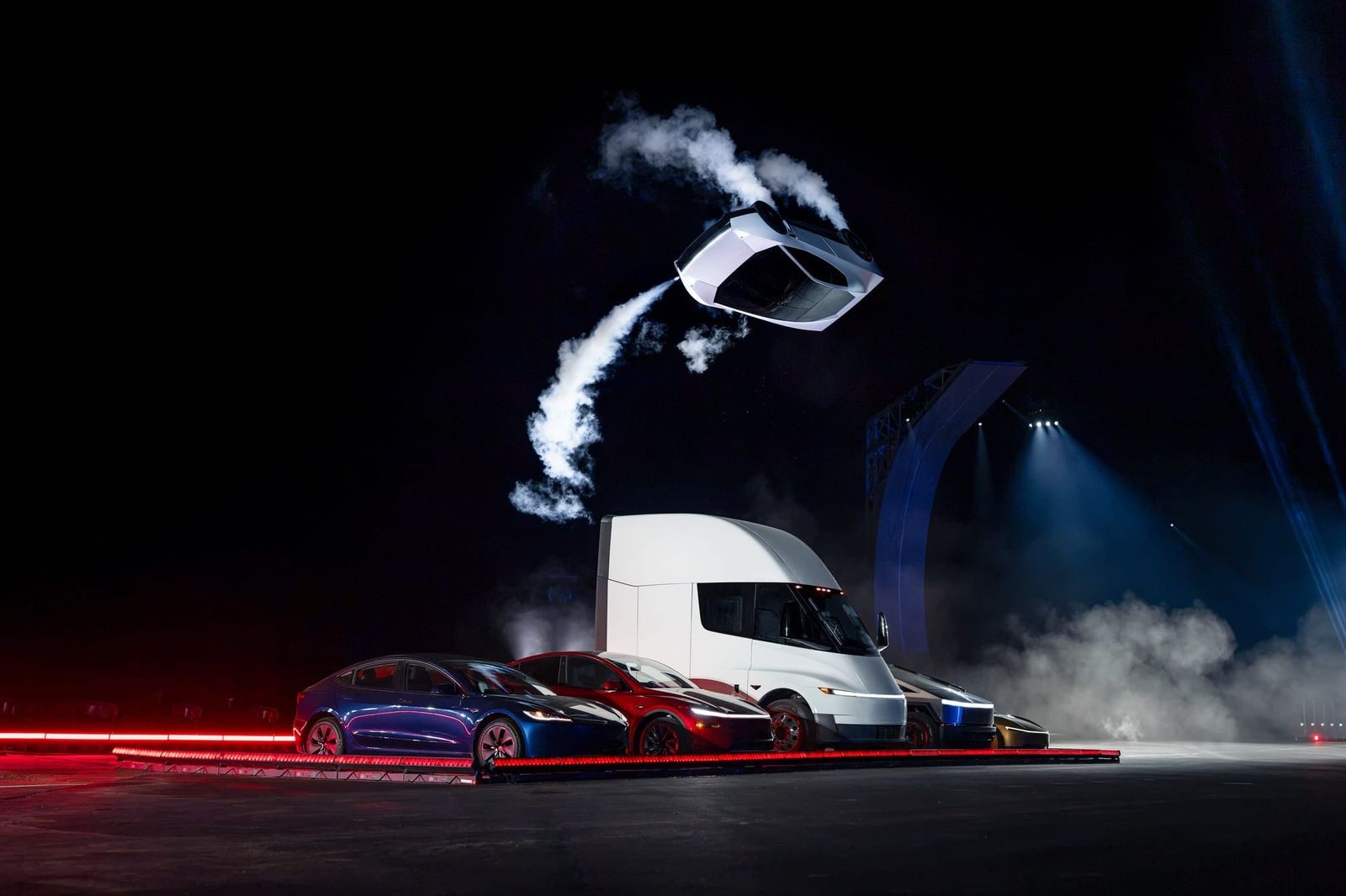 Tesla Roadster flipping over a Tesla Model 3, Y, Semi, Cybertruck and Cybercab
