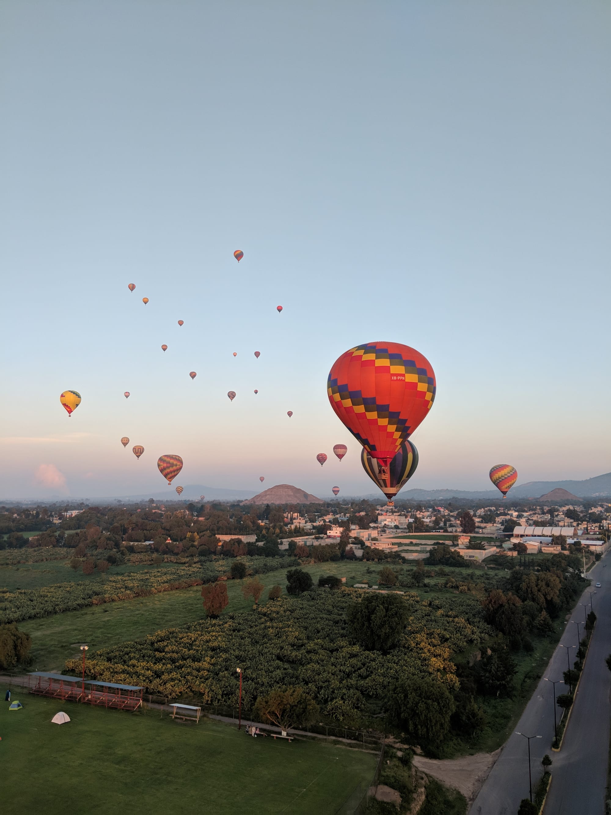 Sunrise view from a hot air balloon over the Teotihuacán pyramids
