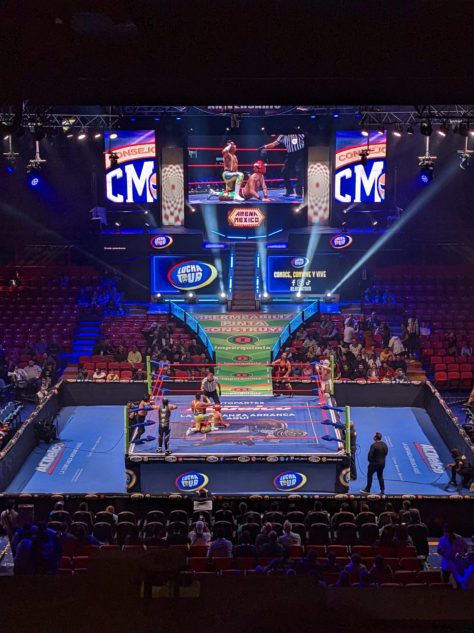 Wide shot of a lucha libre match from the private box in Arena Mexico