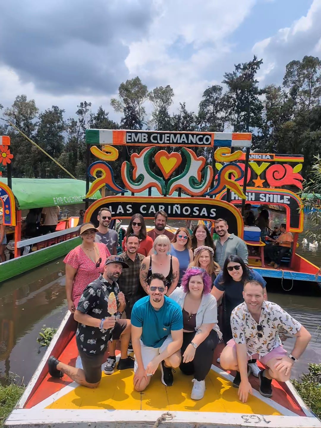 A group photo on a colorful boat in Xochimilco, Mexico City