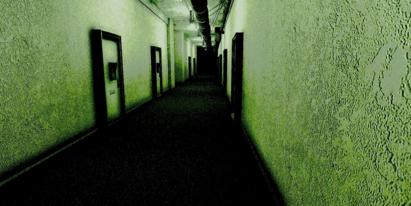 Screenshot from Dead Letter Dept., the long liminal hallway to your place of work. An eerie shade of green and unnaturally dark floor and doorways.