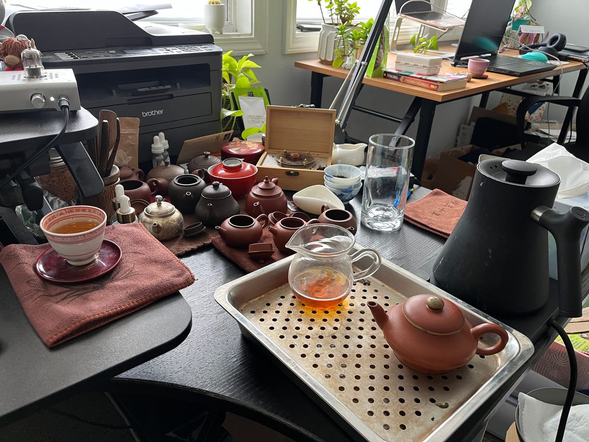 My desk where I sit and brew tea during and surrounding work.