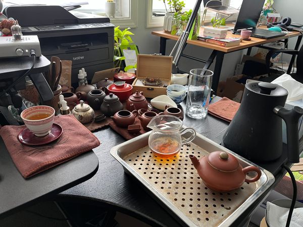 My desk where I sit and brew tea during and surrounding work.