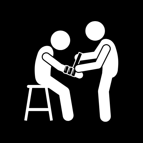 One person wrapping the arm of an injured person