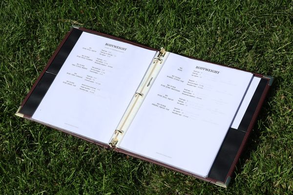 My workout binder in grass