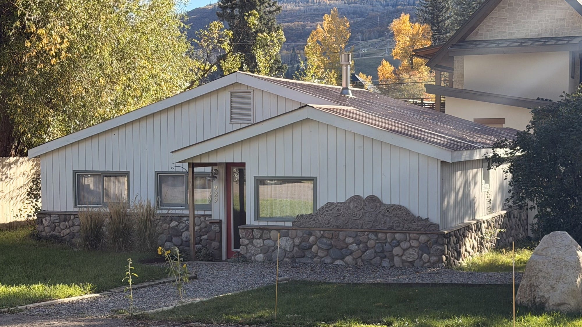 The house at 929 Pine St. on Oct. 15, 2026, with the garage and apartment the Shepards built rising behind it at right. (Yampa Valley Independent)