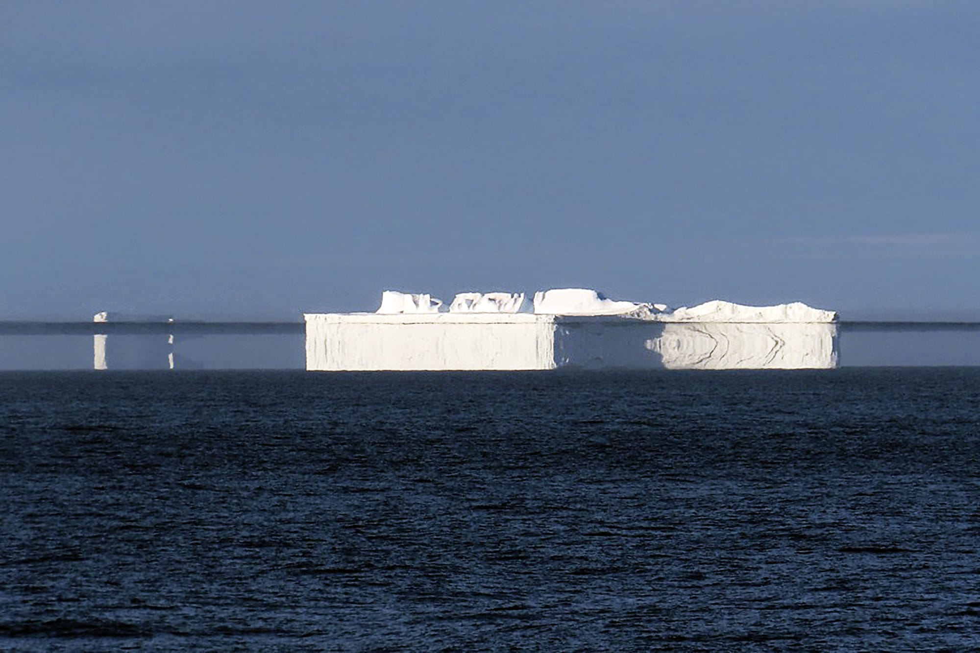 Icebergs distort from a Fata Morgana mirage.