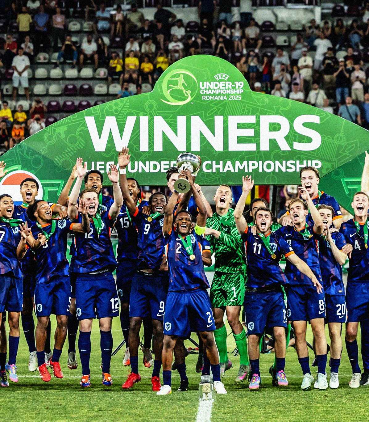 Photo of the Givairo Read and the Netherlands team lifting the 2025 UEFA U-19 EURO trophy