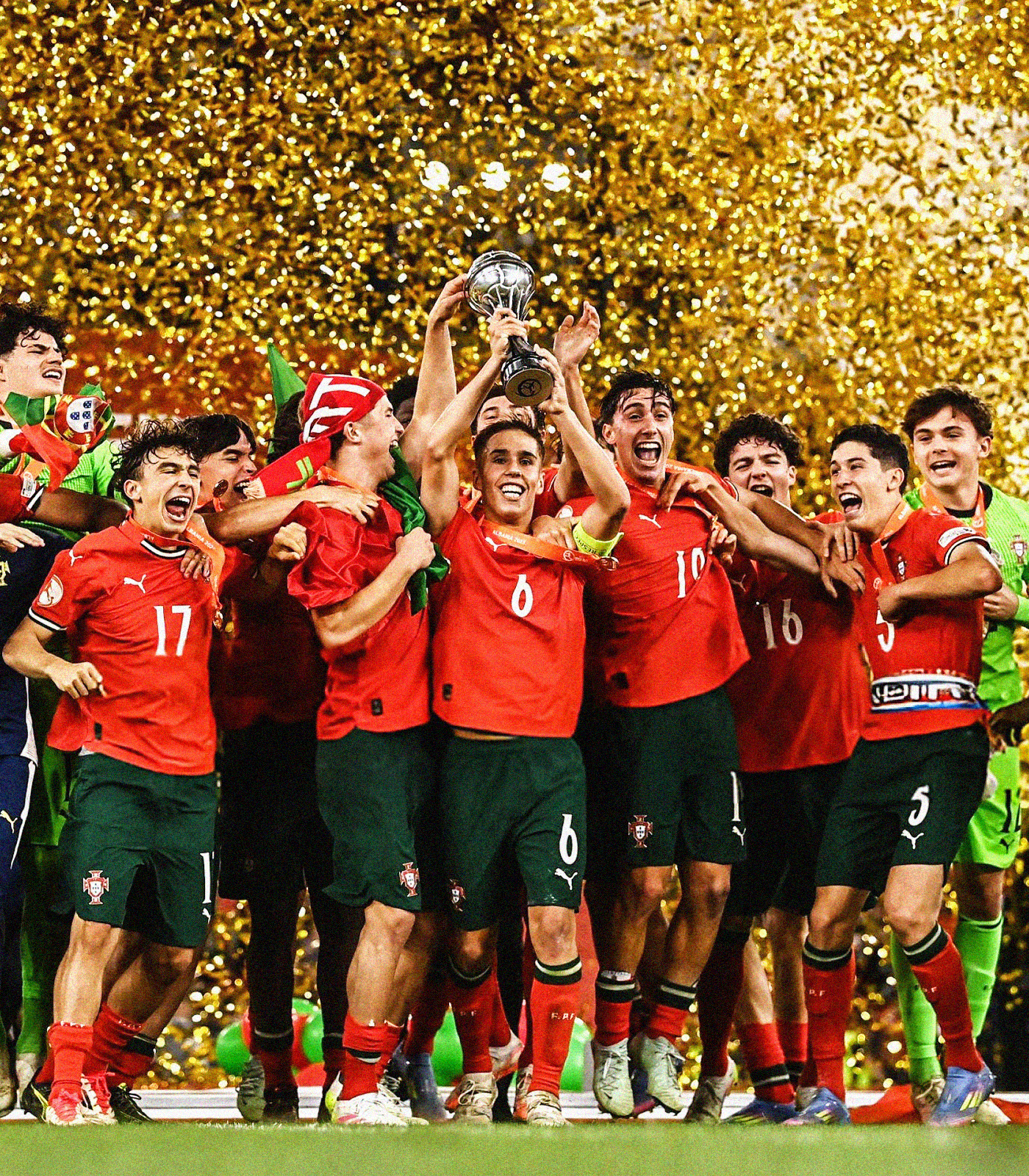 Portugal celebrating with the UEFA U-17 EURO trophy, surrounded by golden confetti