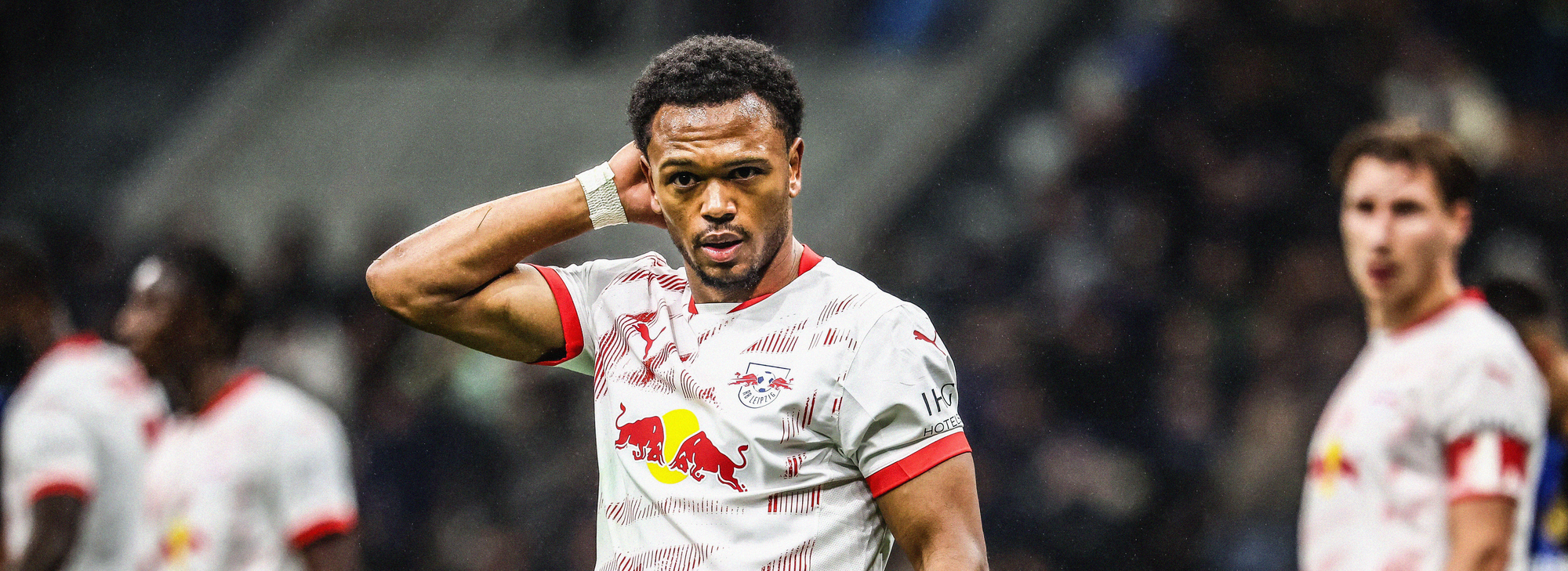Photo of RB Leipzig's Lois Openda, stood with his hand on the backside of his head