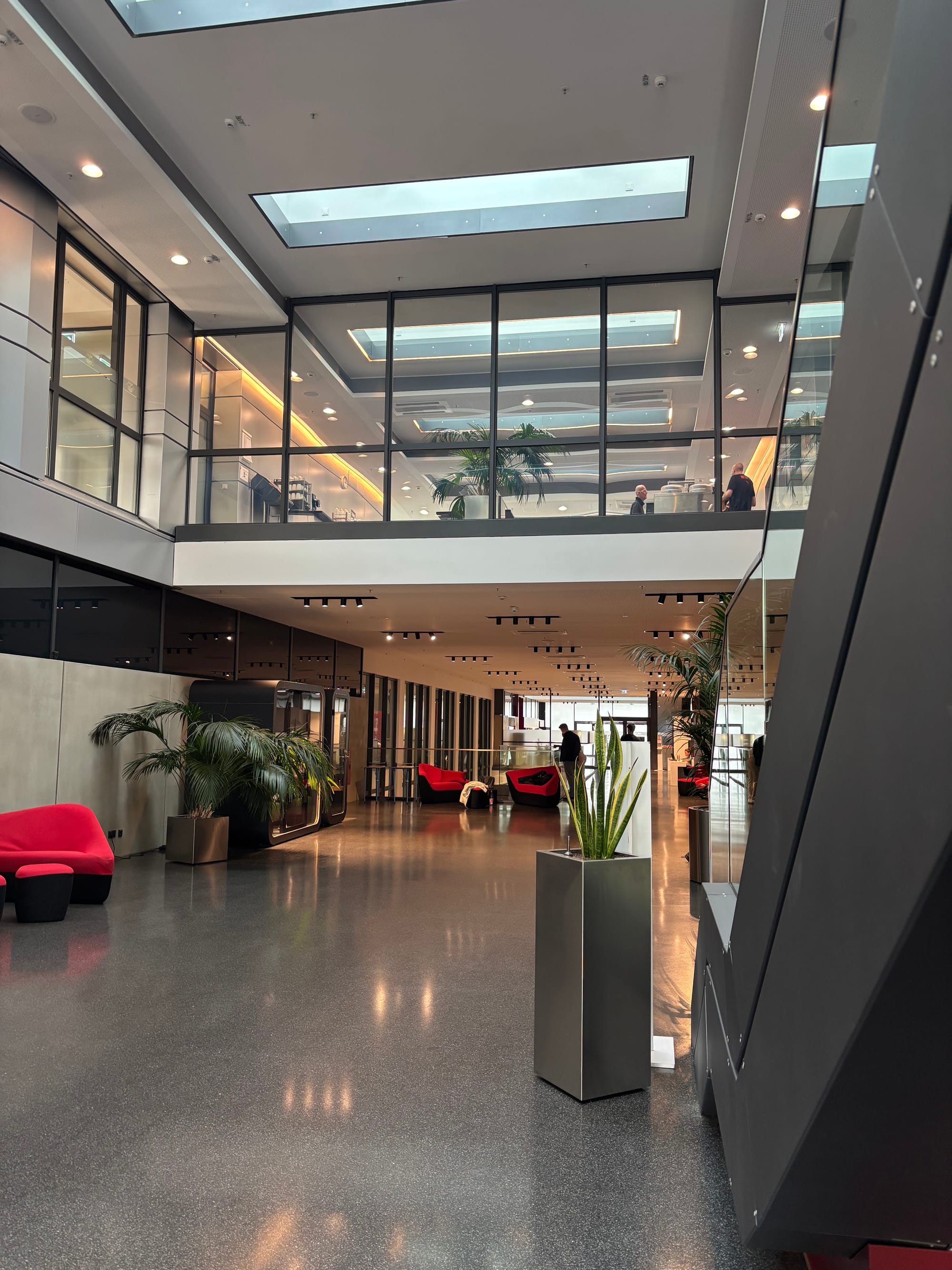 The inside of Leipzig's training centre, a very modern, clean-angled complex in greys and with glass walls.