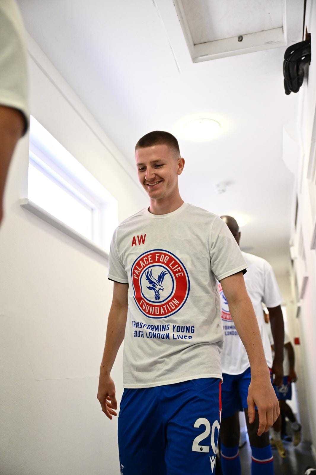 Photo of Crystal Palace's Adam Wharton wearing a 'PALACE FOR LIFE FOUNDATION' pre-match training top