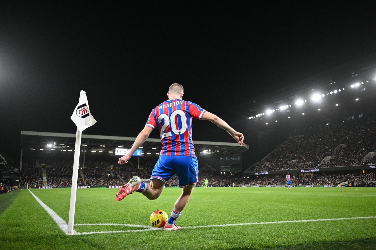 Photo of Crystal Palace's Adam Wharton taking a corner kick at Fulham's Craven Cottage