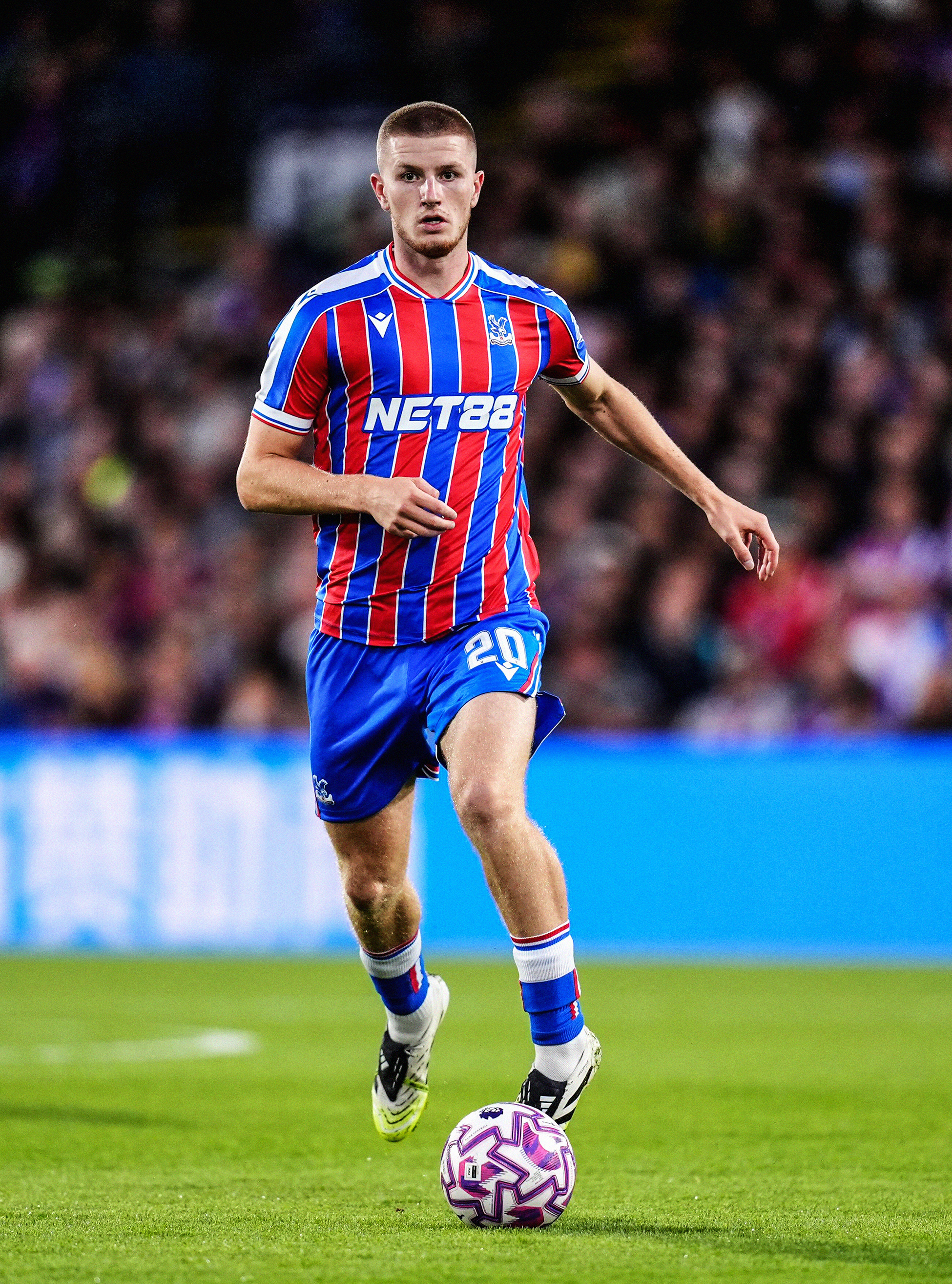 Photo of Adam Wharton carrying the ball in a Premier Legaue match for Crystal Palace