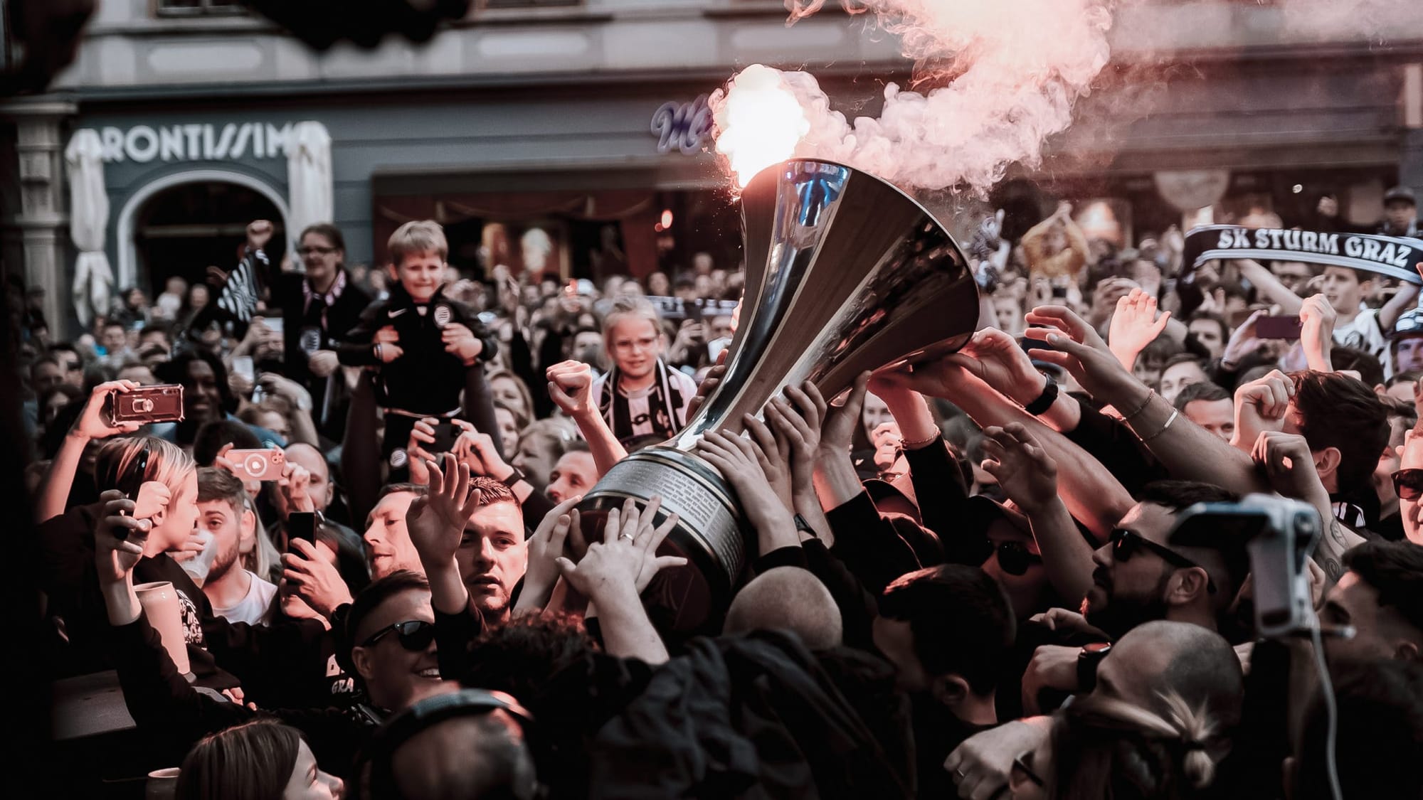 A photo of SK Sturm Graz's fans celebrating with the ÖFB-Cup after the 2023/24 season