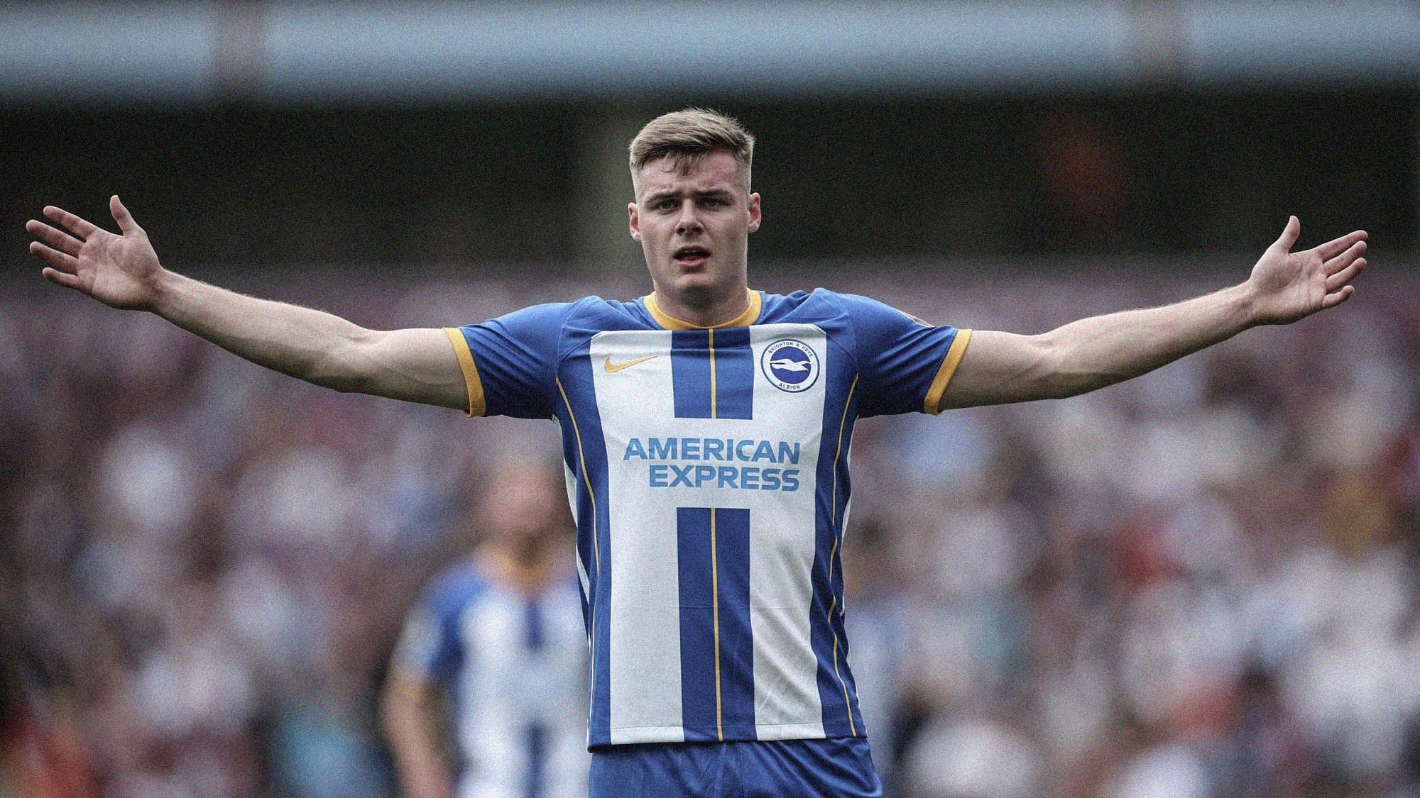 A photo of Evan Ferguson holding his arms out wide while playing for Brighton