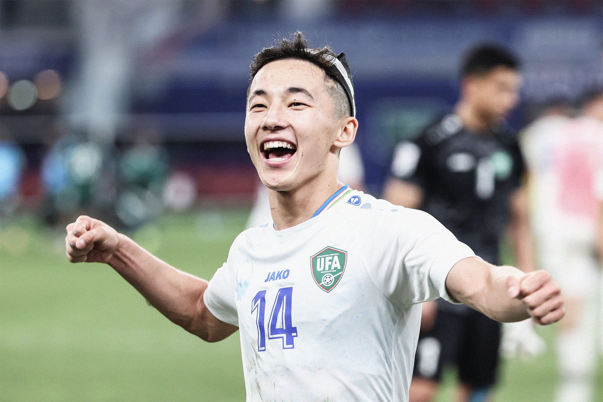 A photo of Assobek Fayzullaev celebrating an Uzbekistan win at the 2024 AFC Asian Cup