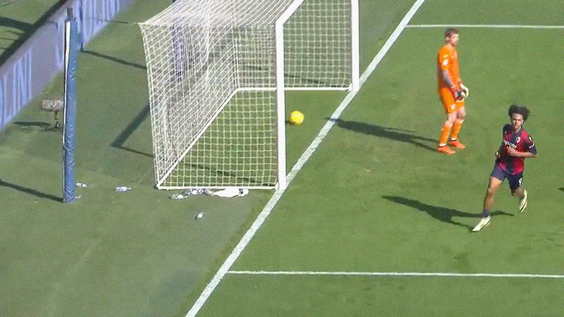 A screenshot of Bologna's Joshua Zirkzee running to celebrate after scoring agaisnt Lazio in Serie A.